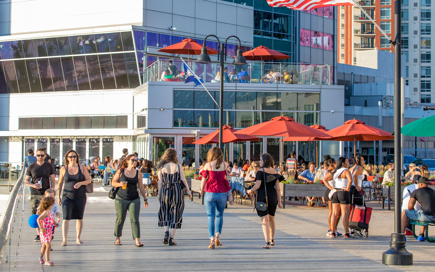 People walking on the Harbor Point Boardwalk in Stamford, CT